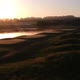 Sunrise drone footage of golf course, water, and fog! - VideoHive Item for Sale