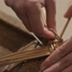 Closeup of Hands Weaving a Basket From Willow Branches - VideoHive Item for Sale