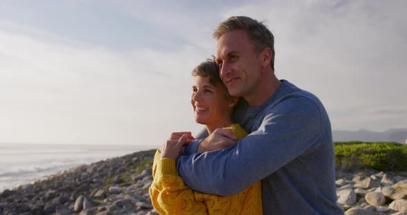 Couple embracing by the sea