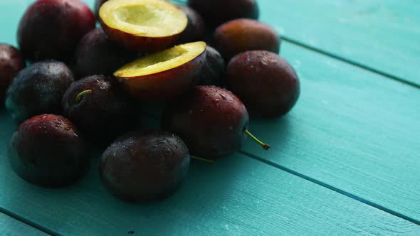 Purple Plums on Blue Wood