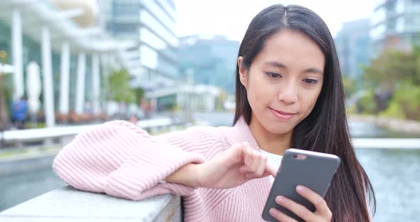 Woman using mobile phone at outdoor