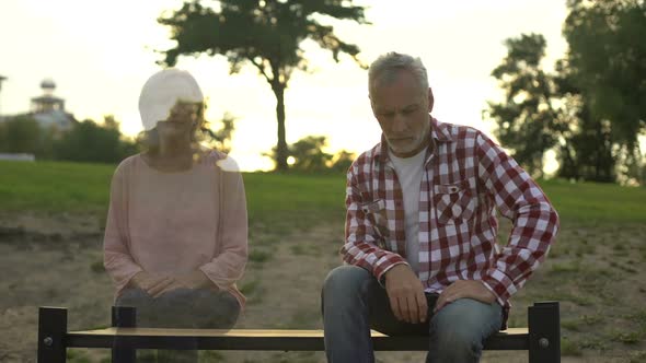 Depressed Old Man Sitting on Bench, Wife Appearing Beside, Loss Sorrow, Memories