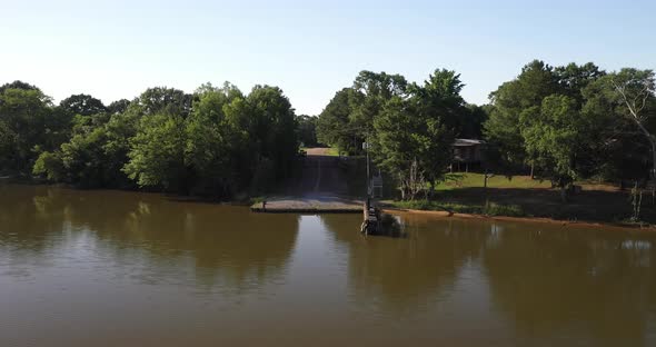 Alabama River in Boykin, Alabama showing ferry dock with drone video moving forward.