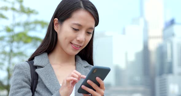 Business woman work on mobile phone at outdoor