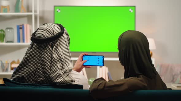 Middle Eastern Family Using Phone with Chroma Key Closeup alt