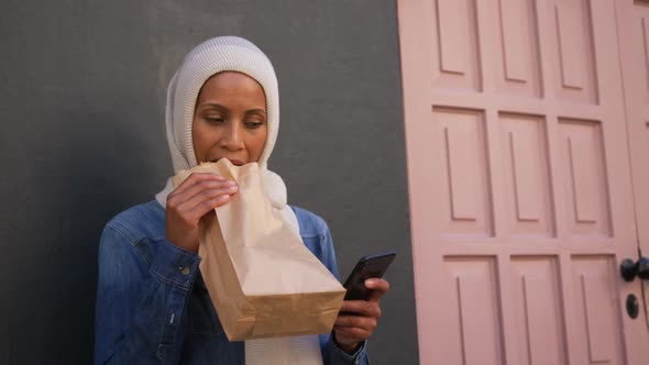 Young woman wearing hijab out and about in the city