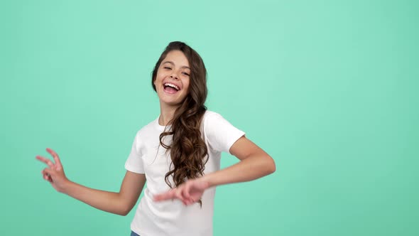 Portrait of Happy Kid Long Curly Hair Dancing Having Fun and Showing Peace Gesture Peace