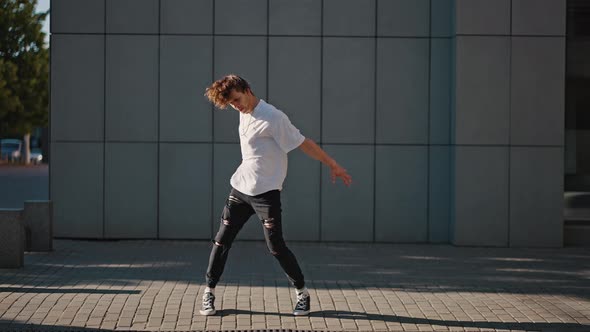 Young Man Performs Hiphop Dance on Empty City Street