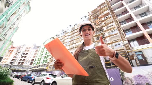 Woman Construction Engineer Wear Safety Hard Hat at Construction Site