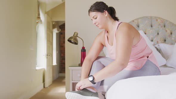 Caucasian vlogger woman preparing herself at home.