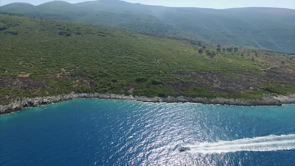 Boat next to mountains in Albania