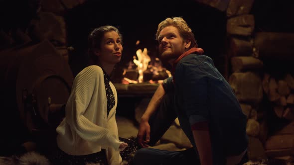 Boyfriend Girlfriend Sitting Fireplace on Evening Date