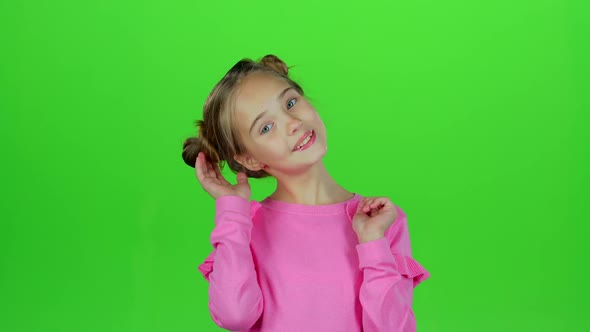 Child Shows Different Emotions. Green Screen. Slow Motion