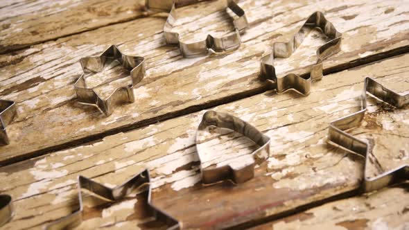 Cookie cutters on wooden table