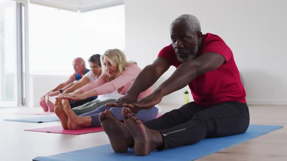 Diverse group of seniors taking part in fitness class