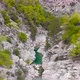 Flight Over a Mountain River and a Trail to a Gorge Among a Coniferous Forest - VideoHive Item for Sale
