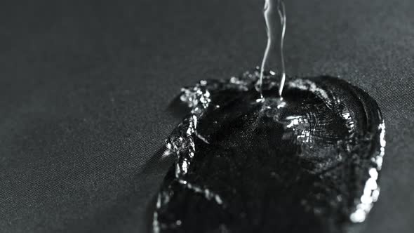 Super Slow Motion Shot of Water Splashing on Waterproof Cloth at 1000Fps.