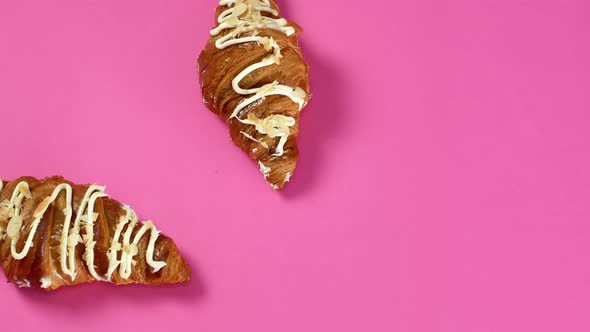 Croissants stop motion on isolated pink background. Baking, Dessert, French croissant.