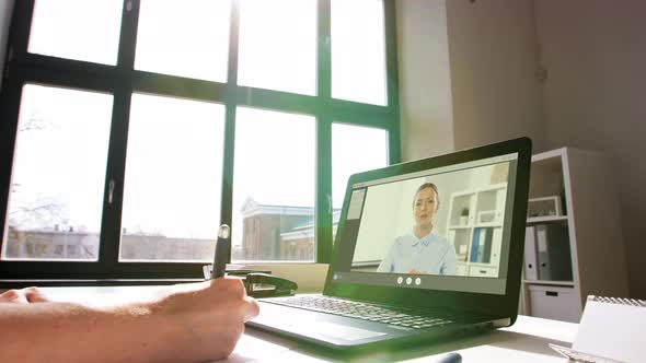 Woman with Laptop Having Video Call at Office