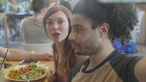 Friends in restaurant posing for selfie