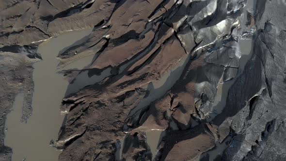 Aerial slow pan upwards of a glacier.