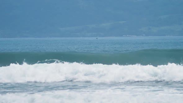 Breaking Waves in the Blue Sea with Huge Splash in Slow Motion Shot