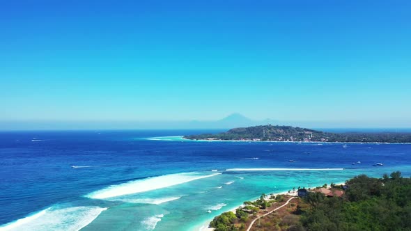 Aerial top view landscape of idyllic bay beach holiday by aqua blue sea with white sandy background 