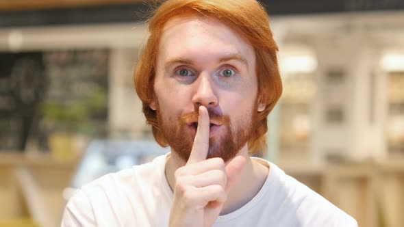 Redhead Beard Man Gesturing  Silence, Finger on Lips, Indoor