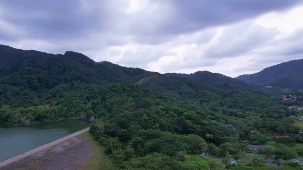 Aerial view Drone Hyperlapse shot of Tropical landscape rainforest with clouds flowing over mountain
