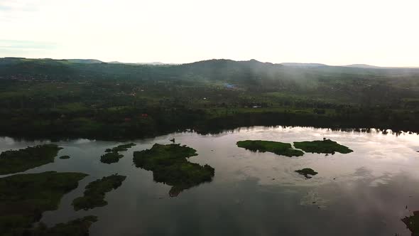 Natural scenery, Africa. River banks of Nile surrounded by lush vegetation. Jinja, Uganda - Aerial d