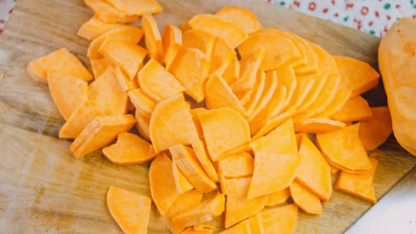 The Chef Cuts the Sweet Potatoes Into Slices
