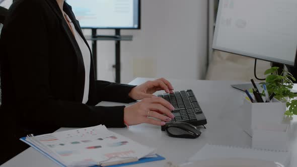 Close Up of Businesswoman Typing on Computer Keyboard