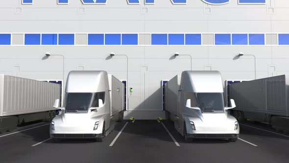 Electric Trailer Trucks at Warehouse Dock with PRODUCT OF FRANCE Text