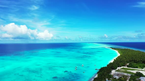 Aerial top down abstract of tropical island beach adventure by blue water with white sandy backgroun