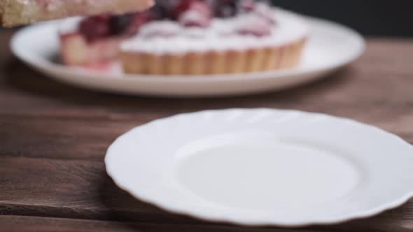 Woman is Putting a Piece of Pie on a Plate