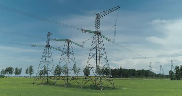 Transportation of Electricity Power Line Near the Highway Industrial View on the Line of Electric