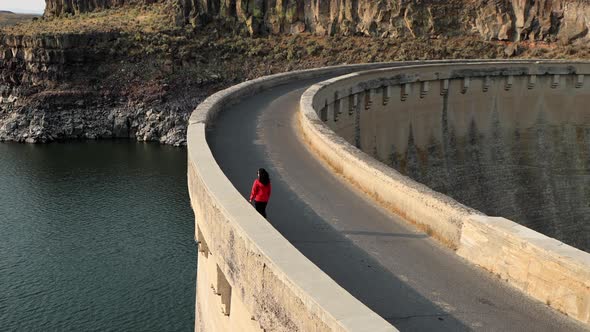 Asian woman hiking near the Salmon Falls Dam in Southern Idaho