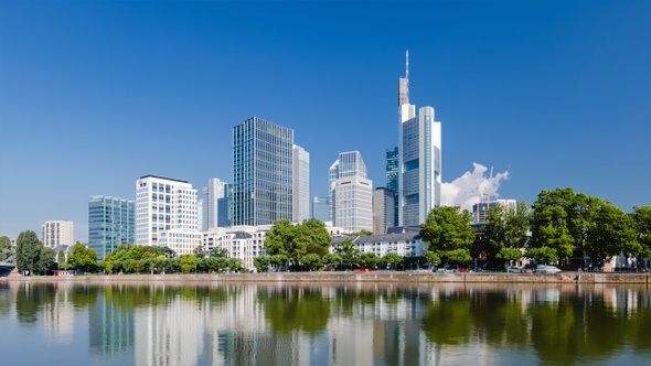 Frankfurt skyline hyperlapse time lapse, blue sky with clouds, office buildings