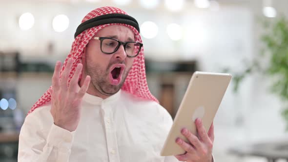 Young Arab Businessman Reacting To Loss on Tablet