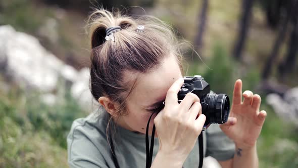 Slim Professional Caucasian Woman Photographing Nature on in the Natural Park