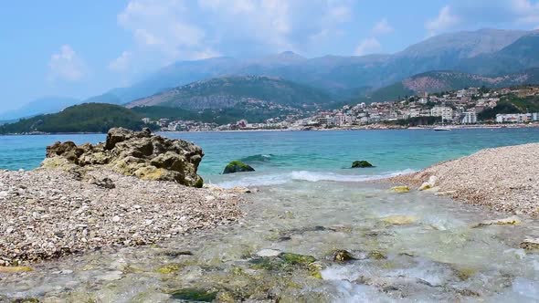 Clear waters of a mountain river close up flow into Ionian Sea. Potam beach. Himare town. Albania.