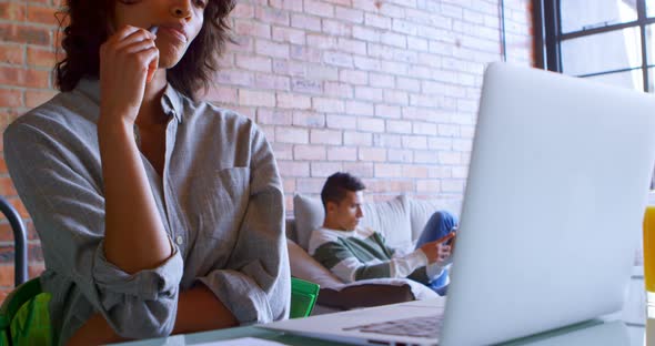 Woman with laptop on table at home 4k