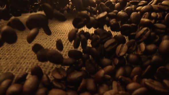 An Explosion of Brown Roasted Coffee Beans Lying on Burlap Cloth