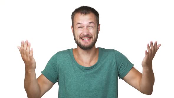 in Slow Motion Headshot Portrait of Bearded Hilarious Man 30s Wearing Shirt Laughing Chuckling