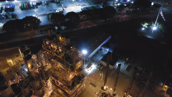 Modern Petroleum Refinery at Night. Smoking Chimneys and Illuminated Constructions alt