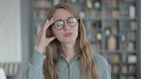 Portrait of Tired Woman Having Headache in Office