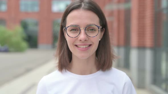 Young Woman Smiling at Camera, Outdoor