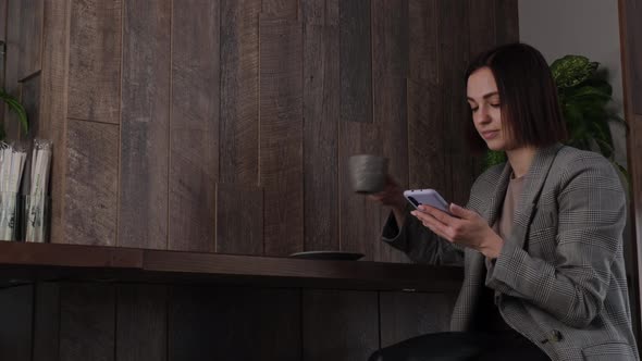 Girl Drinking Coffee at the Cafe Counter