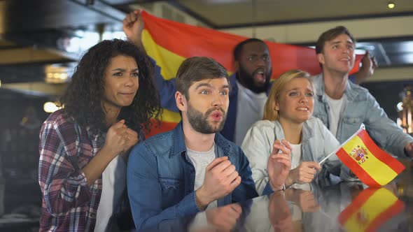 Sport Fans Waving Spanish Flag, Supporting National Team, Upset About Defeat