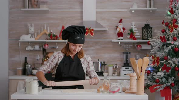 Portrait of Happy Child Wearing Apron Making Homemade Dough Using Rollling Pin